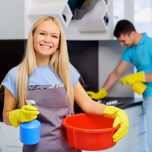 young-maids-cleaning-in-the-kitchen-picture-id880420748